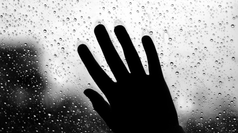 grayscale photo of persons hand